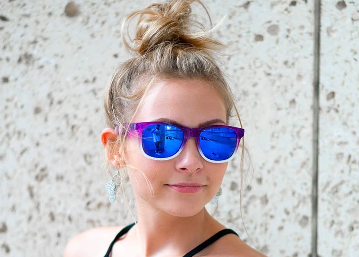 Model wearing Classic 145mm large sunglasses in Purple Haze – bold colourway and wide fit comfort.