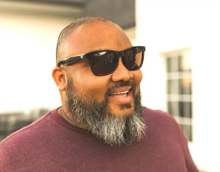 Model wearing Classic 165mm XXL polarised sunglasses in Tortoise Matt with brown ember lenses – comfortable wide fit for large heads.