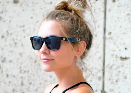 Model wearing Classic 145mm oversize sunglasses in Black Matt – large frame shades with a clean matte finish.