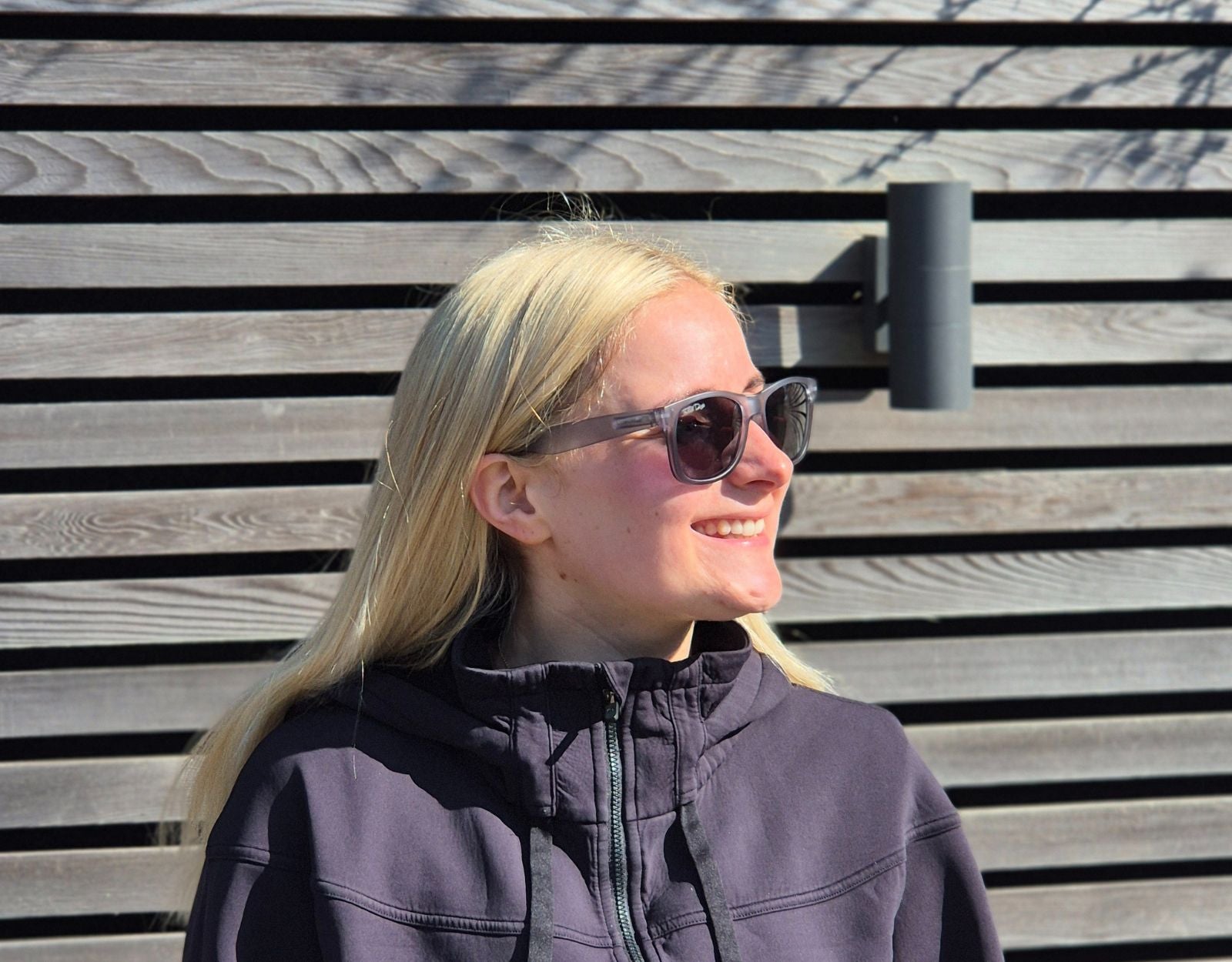 Model wearing Classic 145mm large frame shades in Slate Grey – stylish polarised sunglasses with a refined grey finish.