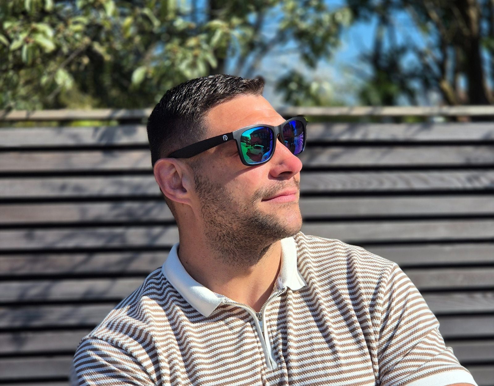 Model wearing Classic 155mm XL extra wide sunglasses with green lenses – secure fit and vibrant mirrored finish.