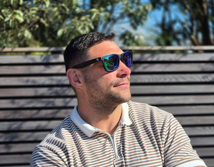 Model wearing Classic 155mm XL extra wide sunglasses with green lenses – secure fit and vibrant mirrored finish.