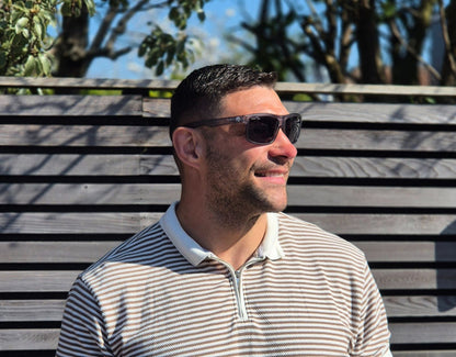 Model wearing Sport 155mm XL sunglasses in Slate Grey – polarised sport shades designed for round faces and large heads.