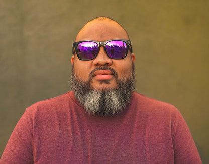 Model wearing Classic 165mm XXL extra wide sunglasses in Black Gloss with purple lenses – polarised, stylish, and made for big heads.