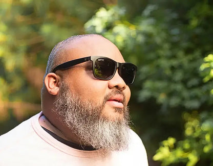 Model wearing Classic 165mm XXL blackout polarised sunglasses – extra wide sunglasses for large heads with a bold matte finish.