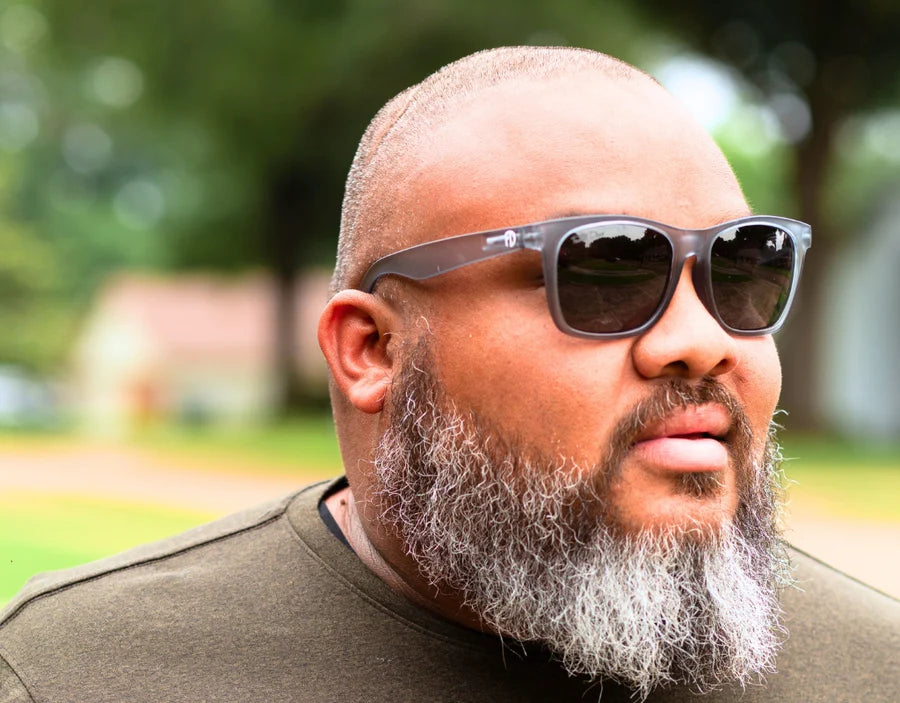 Model wearing Classic 165mm XXL polarised sunglasses for wide faces in Grey Slate – sleek, understated fit for large heads.