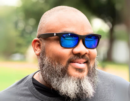 Model wearing The Gent 165mm XXL polarised sunglasses in Black with blue ice lenses – cool-toned style for wide faces.