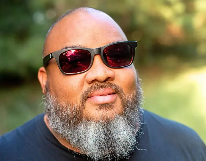 Model wearing The Gent 165mm XXL wide fit sunglasses in Black with red lava polarised lenses – made for guys with big heads.