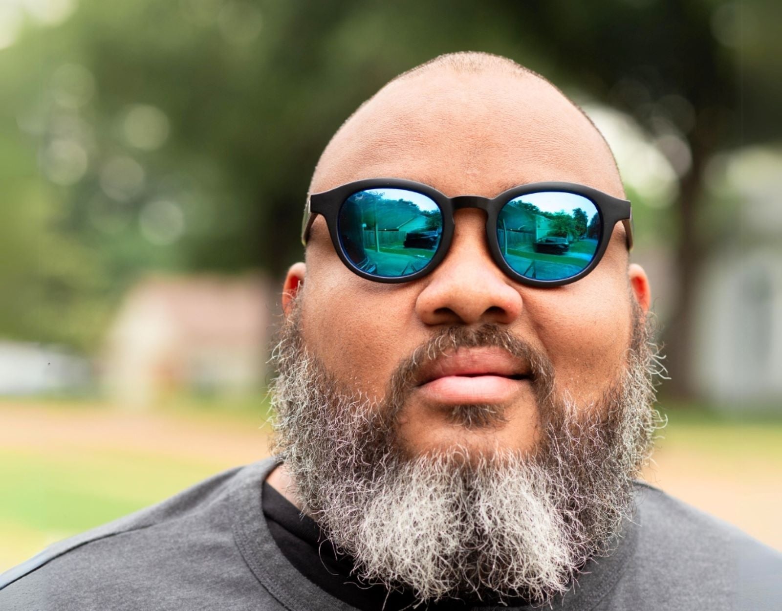 Model wearing The Scholar 165mm XXL large frame sunglasses with blue ice lenses – built for wide faces with modern edge.