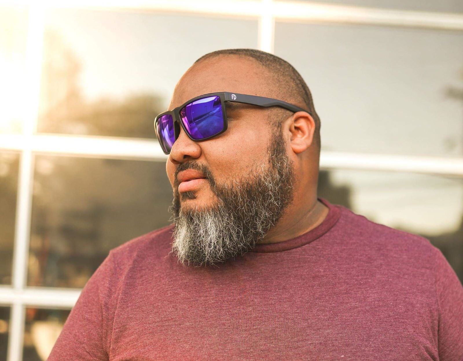 Model wearing Sport 165mm XXL shades for big heads in Black with blue ice lenses – extra wide and performance-ready.