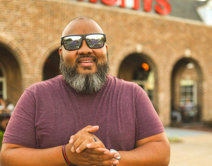 Model wearing Sport 165mm XXL big head sunglasses in Black with chrome polarised lenses – secure and ready for action.