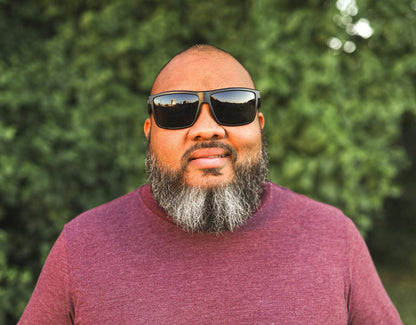 Model wearing Sport 165mm XXL shades for big heads in Black with black smoke lenses – snug, secure fit for sport and everyday wear.